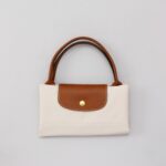 کیف زنانه رنگ استخوانی اورجینال سایز M برند لانگ چمپ Longchamp - Image 5